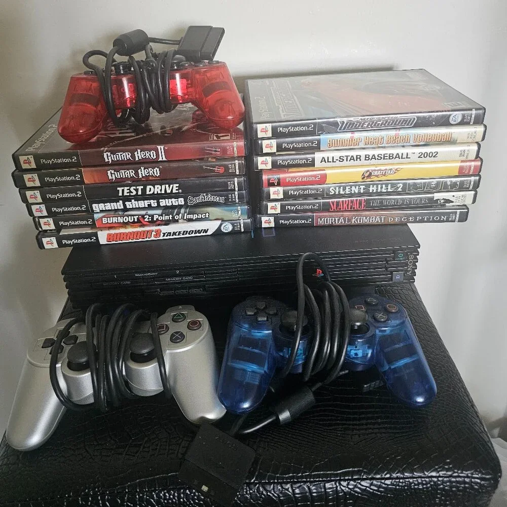 Playsation 2 (PS2 Fat) with controllers and games and PS2 Slim